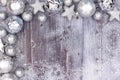 Silver Christmas ornament top corner border with snow on wood Royalty Free Stock Photo