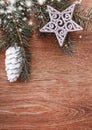 Silver Christmas ornaments and fir tree branch on a rustic wooden background. Xmas card. Happy New Year. Top view Royalty Free Stock Photo