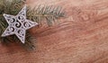 Silver Christmas ornaments and fir tree branch on a rustic wooden background. Xmas card. Happy New Year. Top view Royalty Free Stock Photo