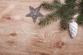 Silver Christmas ornaments and fir tree branch on a rustic wooden background. Xmas card. Happy New Year. Top view Royalty Free Stock Photo