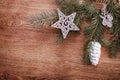 Silver Christmas ornaments and fir tree branch on a rustic wooden background. Xmas card. Happy New Year. Top view Royalty Free Stock Photo