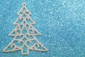 Silver Christmas tree decoration on blue background Royalty Free Stock Photo