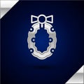 Silver Christmas wreath icon isolated on dark blue background. Merry Christmas and Happy New Year. Vector Royalty Free Stock Photo