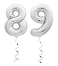 Silver chrome numbereighty nine 89 made of inflatable balloon with ribbon on white Royalty Free Stock Photo