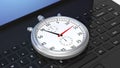 Silver chronometer on black laptop Royalty Free Stock Photo