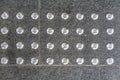 Silver circle dot pattern texture of a Non-slip Pattern on a walkway concrete Royalty Free Stock Photo