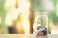 Silver coin in a dozen glasses. Money Saving Media Long-term investment Good money management. as background business concept and Royalty Free Stock Photo