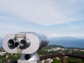 Silver coin operated binoculars looking out Royalty Free Stock Photo