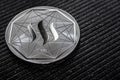 The silver coin of the Steem cryptocurrency on a gray background Royalty Free Stock Photo