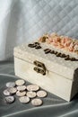 Silver coins and a box with the phrase yes, I do for a religious wedding celebration in Spain.