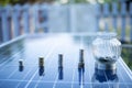 Silver coins on solar panels Cells help store solar energy. Then use it as electricity for homes and buildings to use, reducing