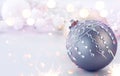 Silver Color Christmas and New Year Decoration on blurred grey background with lights. Border art design, holiday bauble Royalty Free Stock Photo