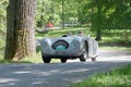 Silver color Veritas Rennsport classic car from 1950 driving on a country road