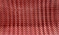 Red Metal mesh.Silver colored metal mesh in close-up,Metal grill.Grid mesh background.