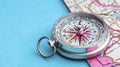 Silver Compass on Folded Map A Close Up View Royalty Free Stock Photo