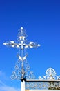 Silver cross on entrance gate of Masonic Cemetery, Canyonville, Oregon Royalty Free Stock Photo