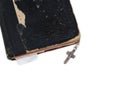 Silver cross on old bible with leather cover