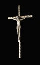 Silver crucifix isolated on black