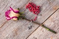 Silver crucifix and old rose