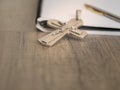 The silver crucifix and a pen on the a blank note book,christian concept Royalty Free Stock Photo