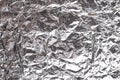 Silver crumpled foil shiny metal texture background wrapping paper for wallpaper decoration element Royalty Free Stock Photo