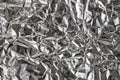 Silver crumpled foil shiny metal texture background wrapping paper for wallpaper decoration element Royalty Free Stock Photo