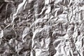 Silver crumpled foil shiny metal texture background wrapping paper for wallpaper decoration element Royalty Free Stock Photo