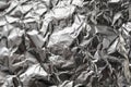 Silver crumpled foil shiny metal texture background wrapping paper for wallpaper decoration element Royalty Free Stock Photo