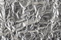 Silver crumpled foil shiny metal texture background wrapping paper for wallpaper decoration element Royalty Free Stock Photo