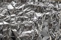 Silver crumpled foil shiny metal texture background wrapping paper for wallpaper decoration element Royalty Free Stock Photo