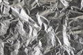 Silver crumpled foil shiny metal texture background wrapping paper for wallpaper decoration element Royalty Free Stock Photo