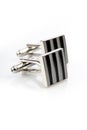 Silver cuff links on white background Royalty Free Stock Photo