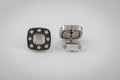 Silver cufflinks with black diamonds and white diamonds in the middle, isolated on white background. Royalty Free Stock Photo