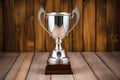 silver cup trophy on a polished wooden background Royalty Free Stock Photo