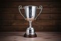 silver cup trophy on a polished wooden background Royalty Free Stock Photo