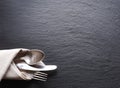 Silver cutlery on the grey background. Royalty Free Stock Photo