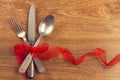 Silver cutlery on a wooden table Royalty Free Stock Photo