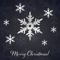 Silver 3D snowflakes on the dark winter and New Year background with snowflake silhouettes. Royalty Free Stock Photo