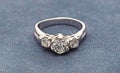 Silver Diamond Ring on Blue Gray Velvet Background Royalty Free Stock Photo