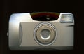 Silver 35mm Film Point and Shoot Pocket Camera with Built In Flash and Zoom Lens Royalty Free Stock Photo