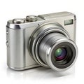 A silver digital compact camera with a lens on a white background digital camera metallic Royalty Free Stock Photo
