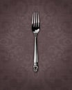 Silver dinner fork on linen