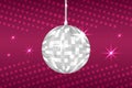 Silver disco ball on red background. Glowing discoball. Night club party equipment. Shiny mirror ball