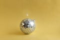 Disco ball with sparkle on golden background Royalty Free Stock Photo