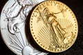 silver eagle and golden american eagle one ounce coins Royalty Free Stock Photo