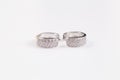 Silver earrings with diamonds macro shot Royalty Free Stock Photo
