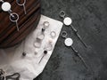 Silver earrings on a flat dark background