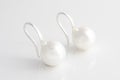 Silver earrings pearl isolated on white Royalty Free Stock Photo