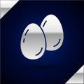 Silver Easter eggs icon isolated on dark blue background. Happy Easter. Vector