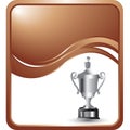 Silver elaborate trophy on a bronze wave backdrop